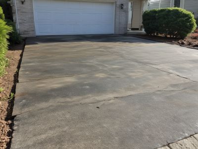 Dirty driveway before professional power washing service
